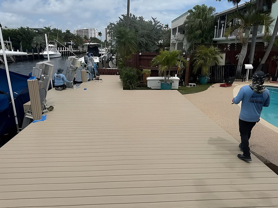Large custom dock installation with composite decking and covered yacht — South Florida