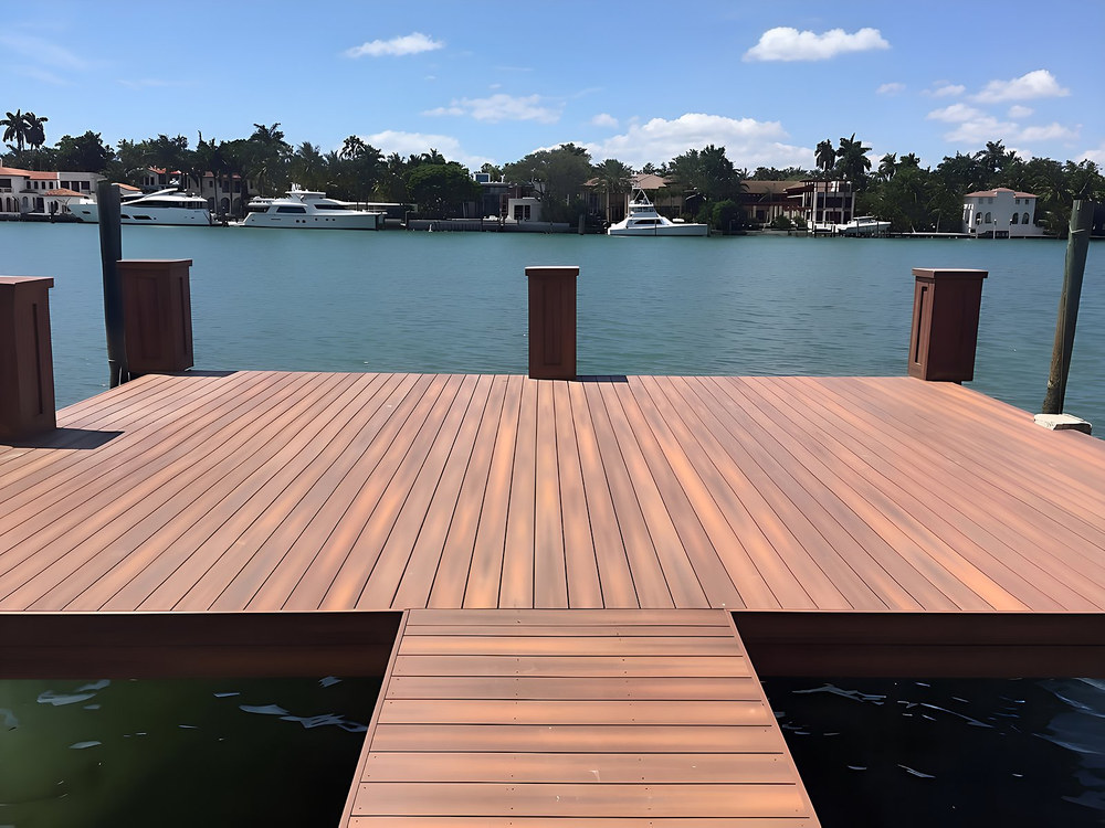 Ipe hardwood dock platform with decorative piling caps and luxury yachts — South Florida