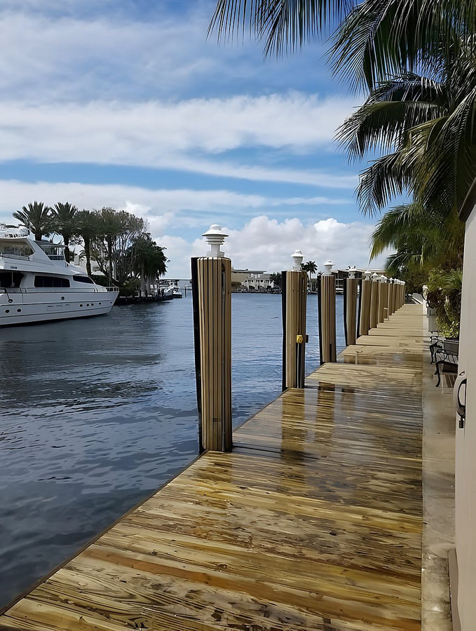 Custom wrapped piling finish on South Florida waterfront dock — Contour Marine