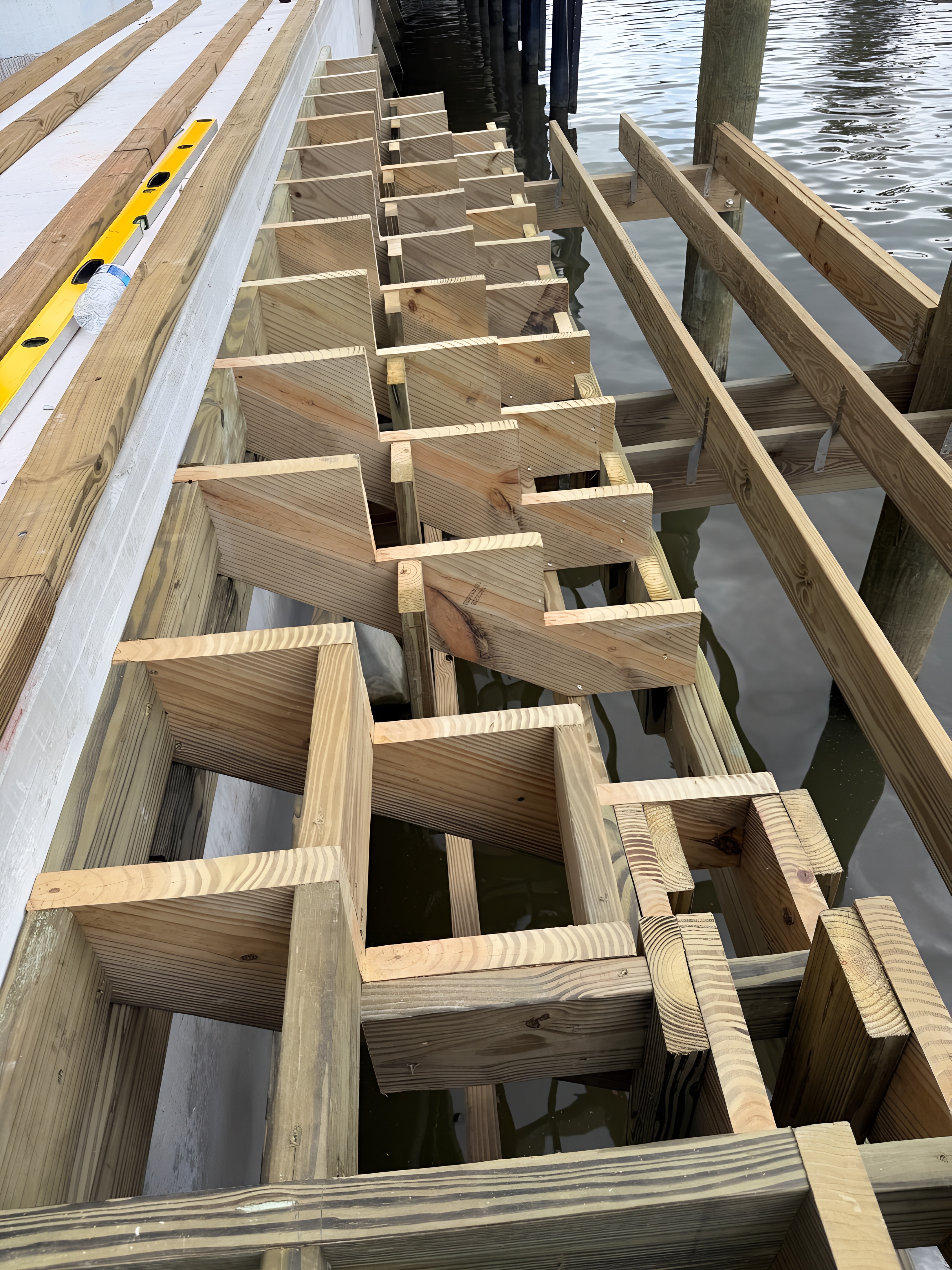Precision structural framing layout over water — Contour Marine marine construction