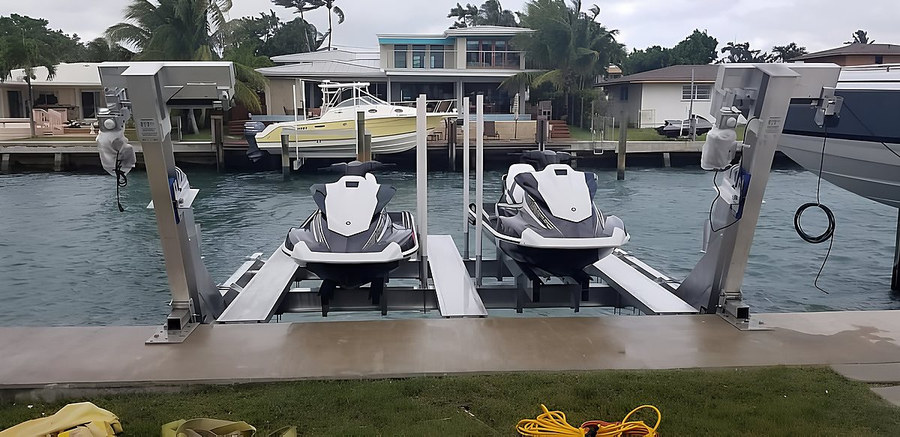 Deco double jet ski lift with dual Yamaha WaveRunners loaded — front-on view