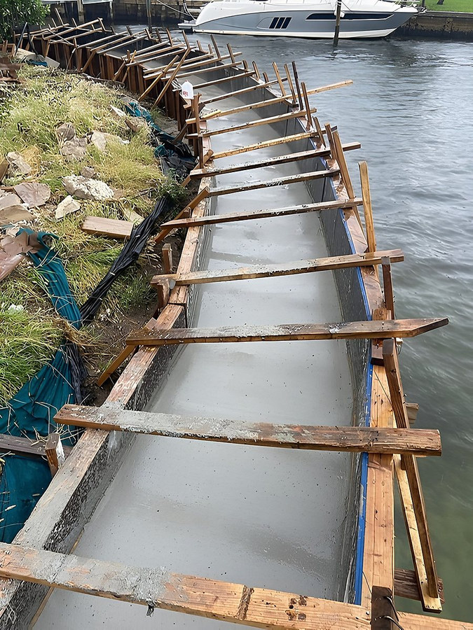 Seawall construction with fresh concrete formwork — South Florida