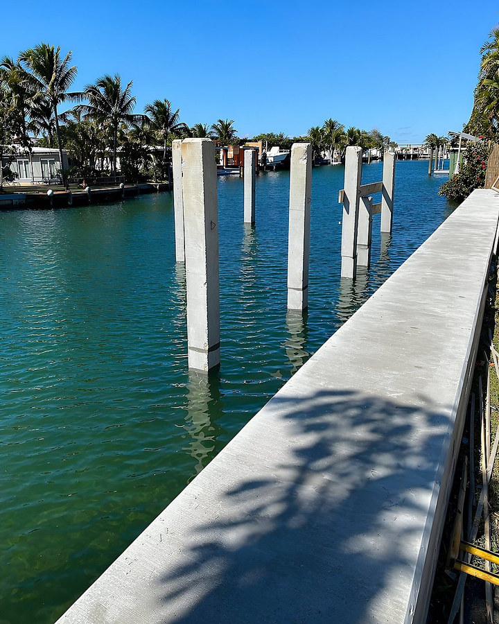 Concrete marine pilings installed along a South Florida canal — Contour Marine